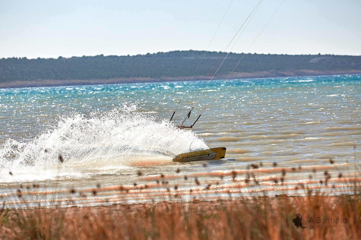 Kitesurfer riding flat water at Ljubač